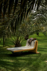 Lacuna daybed in green, under palms