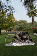 The Milky Way rug in Comet Black, styled outdoors
